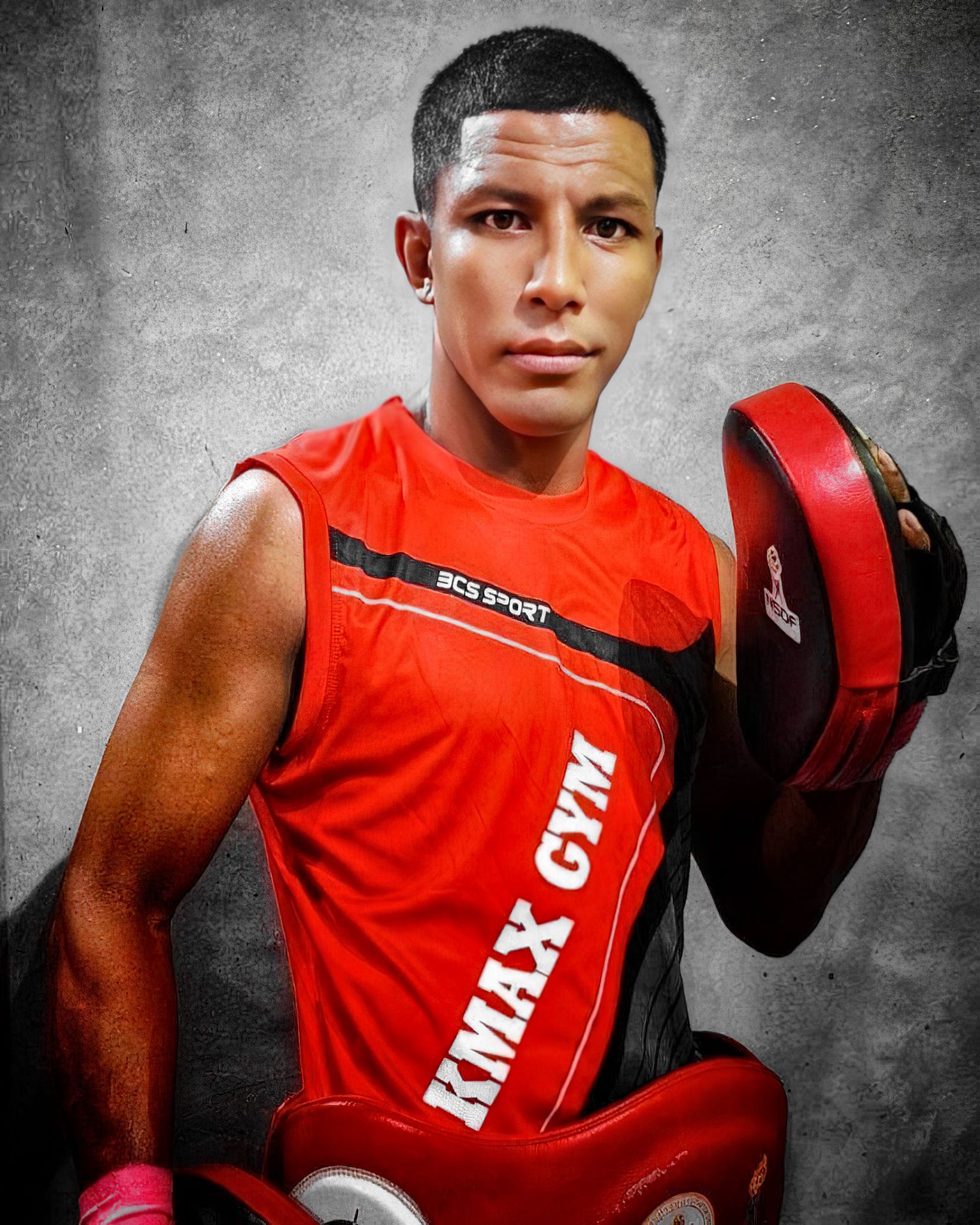 Kru Rak, head Muay Thai trainer, holding pads
